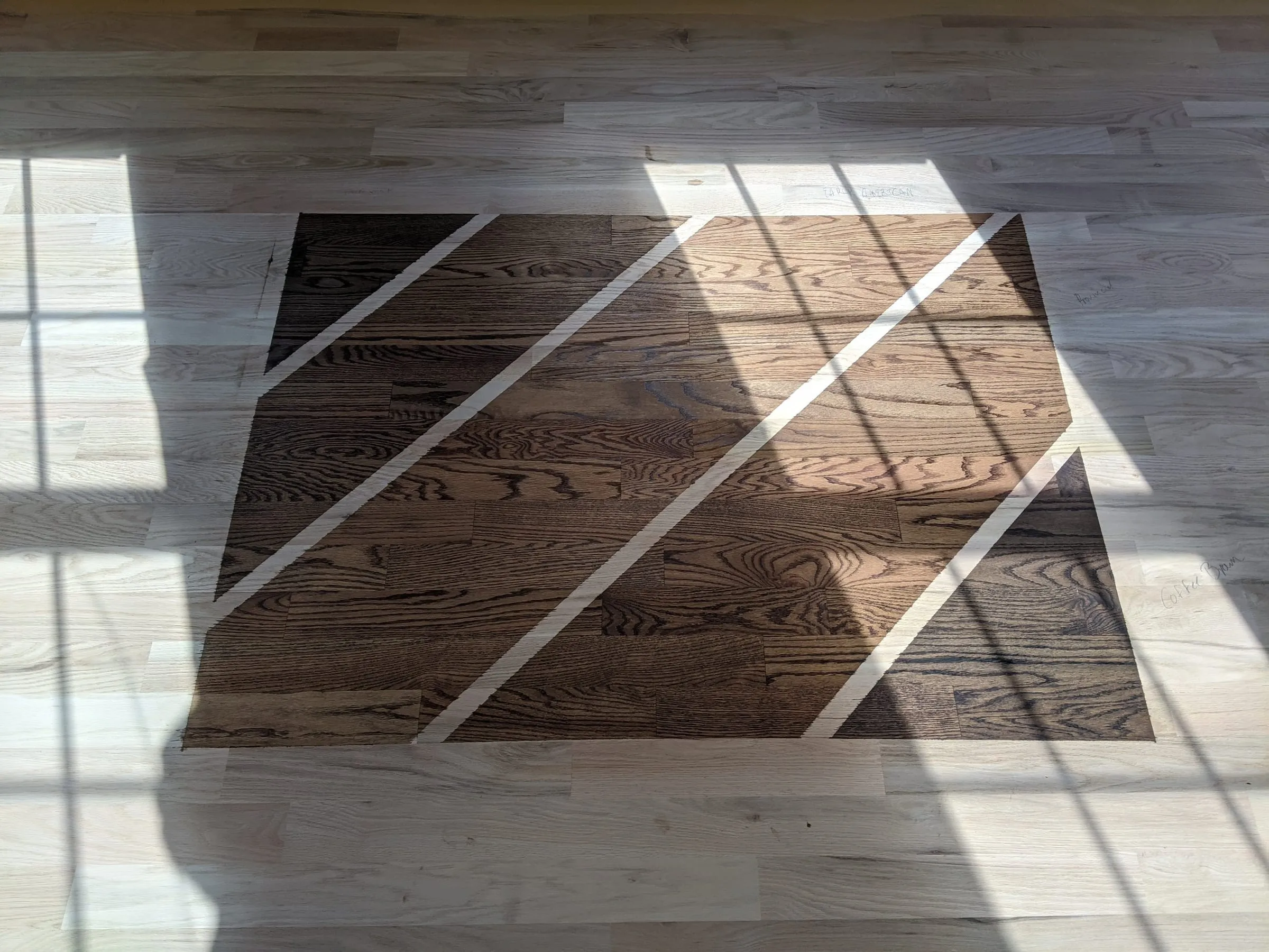 Dark stain sample in a sunlit room of freshly sanded oak